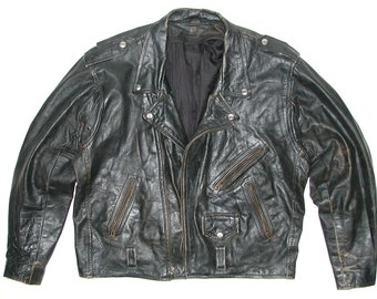 May include: A black leather biker jacket with zipped pockets and a snap fastening. The jacket has a worn look and is made from thick, durable leather.