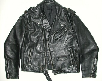 May include: A black leather biker jacket with a zip fastening and a belt at the waist.
