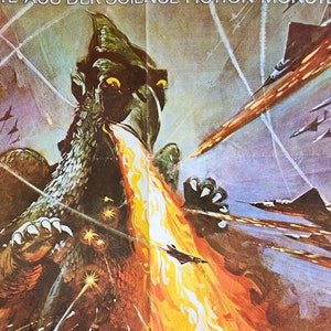 May include: Vintage movie poster featuring a giant monster breathing fire at fighter jets. The monster is green with sharp claws and teeth. The jets are firing back, with explosions and streaks of light in the sky. The poster has a retro, action-packed feel.