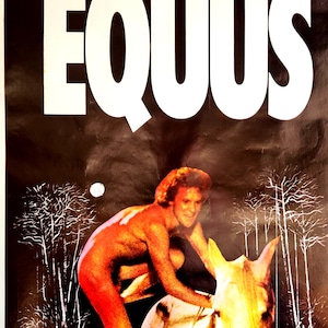 May include: Vintage movie poster for the film "Equus." The poster features the title in large white letters against a dark background. An image of a person and a horse is in the center. Additional text includes the film's cast and crew.