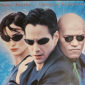 The Matrix-An Original Vintage Movie Poster of the Wachowski&#39;s Sci-Fi Epic with Keanu Reeves, Carrie-Anne Moss, and Laurence Fishburne.