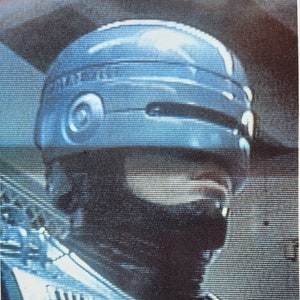 RoboCop-An Original Vintage Italian Movie Poster of Paul Verhoeven&#39;s Futuristic Crime Satire with Peter Weller, Nancy Allen, and Ronny Cox.
