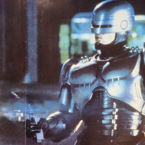 RoboCop-An Original Vintage Italian Movie Poster of Paul Verhoeven&#39;s Futuristic Crime Satire with Peter Weller, Nancy Allen, and Ronny Cox.
