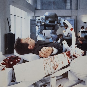 RoboCop-An Original Vintage Italian Movie Poster of Paul Verhoeven&#39;s Futuristic Crime Satire with Peter Weller, Nancy Allen, and Ronny Cox.