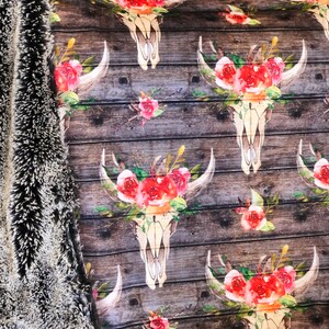 May include: A brown wooden background with a repeating pattern of white skull designs with red and pink floral accents.