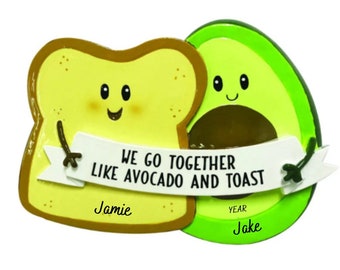 May include: A decorative ornament featuring a slice of toast and an avocado, both with smiling faces. A banner reads "WE GO TOGETHER LIKE AVOCADO AND TOAST". The names "Jamie" and "Jake" are also included.