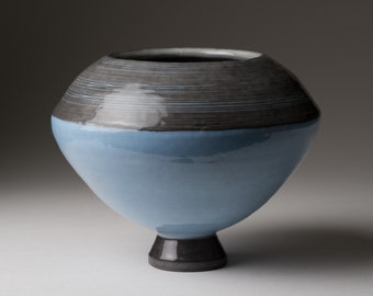 Hand thrown earthenware ceramic ball vase.