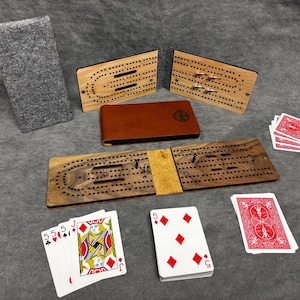 Planche à bébé de voyage pliante compacte en cuir avec chevilles en métal - Jeu portable en noyer pour le camping et les déplacements