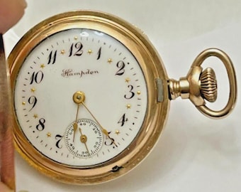 Reloj de bolsillo antiguo Hampden con diadema y caja de caza, esfera elegante