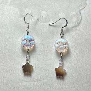 iridescent crystal stargazing moon face celestial shell stars | beaded dangle earrings on french ear wires