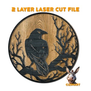 May include: A laser cut file design of a black raven perched on a branch with bare branches. The design is on a wood background. The file is for two layers.
