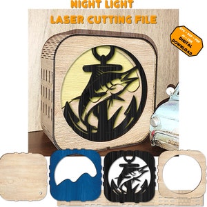 Op de afbeelding: Houten nachtlampje met een lasergesneden ontwerp met een vis en anker. Het nachtlampje heeft een vierkante vorm met een lichtgele achtergrond. De tekst luidt "NIGHT LIGHT LASER CUTTING FILE". Inclusief SVG-DXF-PDF AI-CDR DIGITAL DOWNLOAD.