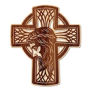 May include: Wooden Celtic cross with a detailed carving of Jesus Christ's face. The cross features intricate knotwork and a light brown border, with a darker brown interior. The image is set against a white background.