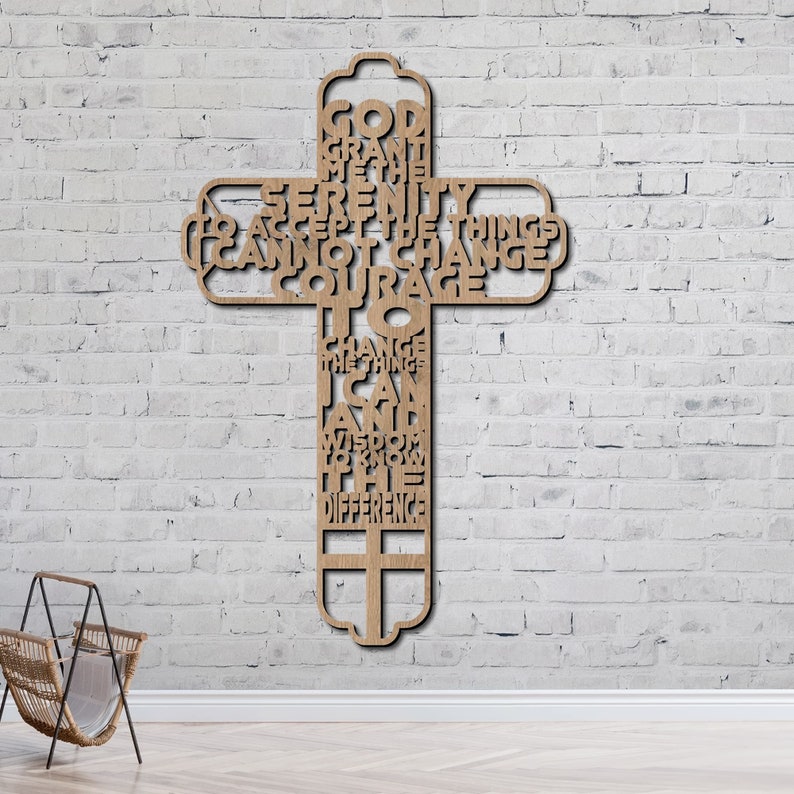 May include: Wooden cross with the Serenity Prayer engraved on it. The prayer reads: "God grant me the serenity to accept the things I cannot change, courage to change the things I can, and wisdom to know the difference."