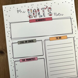 May include: A printable teacher planner with sections for reminders, to do, call or email, top priorities, and notes. The planner has a black and white polka dot border and the title "Mrs. Holt's Notes" is in colourful patterned letters.