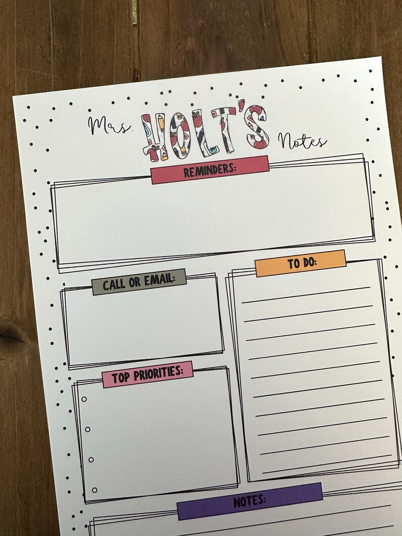 May include: A printable teacher planner with sections for reminders, to do, call or email, top priorities, and notes. The planner has a black and white polka dot border and the title "Mrs. Holt's Notes" is in colourful patterned letters.