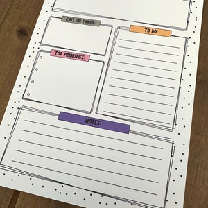 May include: A printable planner page with a black and white polka dot background. The page is divided into sections with headings: "Mas. The VOLT'S Notes", "Reminders", "Call or Email", "To Do", "Top Priorities", and "Notes".