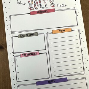 May include: A printable planner page with the title "Mas Holt's Notes". The page is divided into sections for reminders, to do, top priorities, and notes. Each section has a coloured title bar.