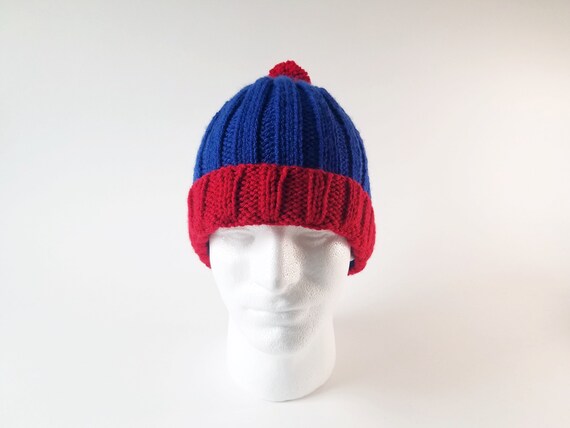 red poof ball hat