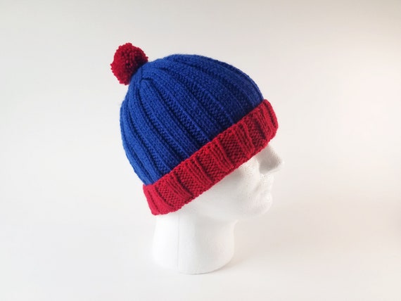 red poof ball hat