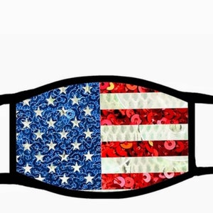 May include: A black fabric face mask with a sequined American flag design. The stars are blue and the stripes are red and white.