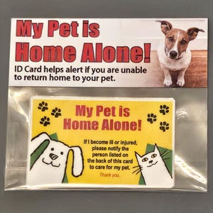 May include: A yellow card with the text "My Pet is Home Alone!" and paw prints. The card also includes a cartoon dog and cat with the text "If I become ill or injured, please notify the person listed on the back of this card to care for my pet. Thank you."