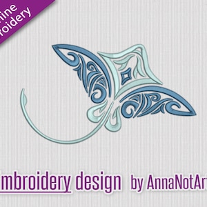 May include: Blue and light blue stylised embroidery design of a manta ray with intricate patterns. The design is on a white fabric background. Embroidery design by AnnaNotArtist.