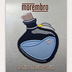 May include: Machine embroidery design of a blue potion bottle with a cork stopper and a blue liquid inside. The bottle is decorated with a yellow rope and a white string.