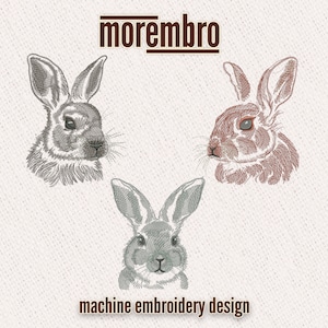 May include: Three machine embroidery designs of rabbit heads. The rabbits are facing forward with their ears up. The designs are in shades of gray and brown.