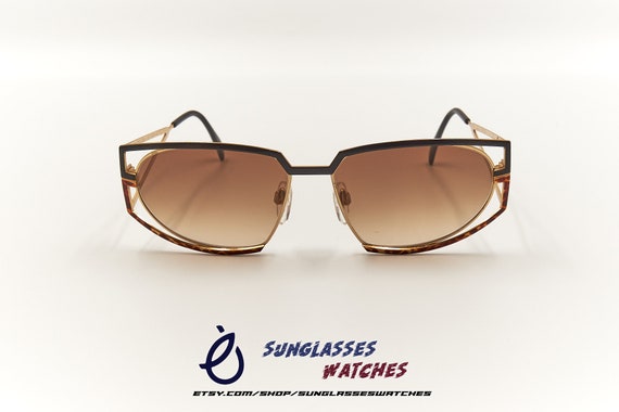 Silhouette Gold and Brown Sunglasses Silhouette Polarized Titanium Rimless Sunglasses; Gold  main image 3
