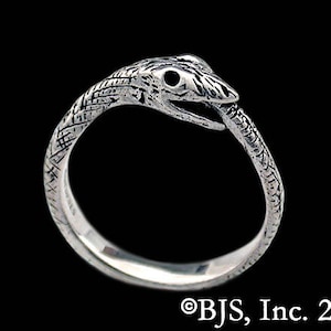 May include: A silver ring with a detailed snake design. The snake's head is facing forward with its mouth open.