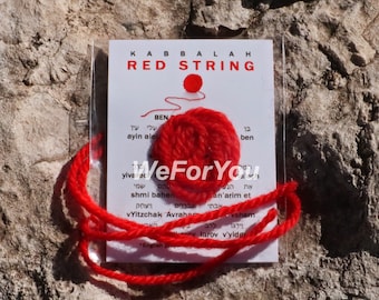 May include: Red string Kabbalah bracelet with a small red knotted circle and Hebrew text on a white card. The card reads "Kabbalah Red String" and includes Hebrew text.