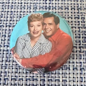 May include: A set of three ceramic mugs with a speckled, matte finish. The mugs are in shades of cream, light gray, and dark gray. Each mug has a simple, minimalist design, perfect for coffee or tea.