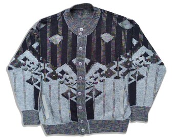 May include: A black and grey cardigan with a geometric pattern. The cardigan has a button-up front and long sleeves.