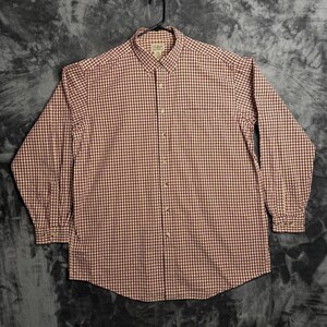 May include: A long-sleeve button-down shirt featuring a small-scale red and white gingham check pattern. The shirt includes a pointed collar, a front button placket with light-colored buttons, and buttoned cuffs. An L.L. Bean label is at the neck.