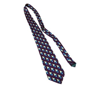 May include: A necktie featuring a deep purple background with a repeating pattern of diamond-shaped motifs. Each diamond contains a smaller, light blue and cream-colored geometric design. The tie is long and narrow, tapering to a pointed end.