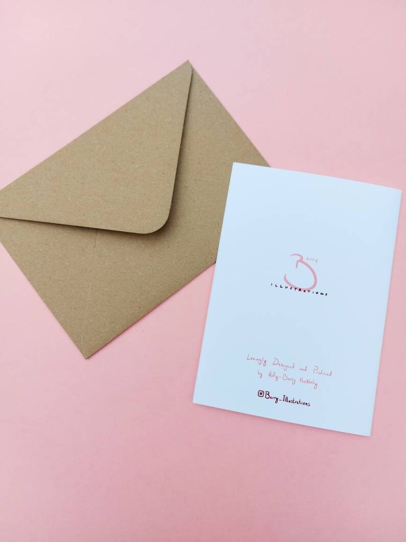 May include: A white card with a pink illustration of a cat with a speech bubble that says "I'm not a morning person". The card is on a pink background. The back of the card has the text "Lovingly Designed and Printed by Ally-Dery Hubbert @Burg_Illustrations".