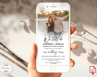 May include: A smartphone displays a wedding anniversary invitation. The invitation features a photo of a couple and the text "We still do" with details about the event, including the date, time, and location. A logo is in the bottom left corner.