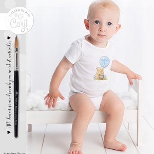 May include: A white onesie with a blue balloon and a bear holding a jar of honey. The balloon has the number 1 and the text "Christopher" on it.