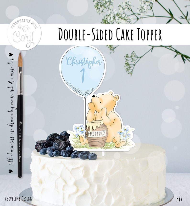 May include: Double-sided cake topper featuring a Winnie the Pooh character holding a honey pot. The balloon is blue and says "Christopher 1".