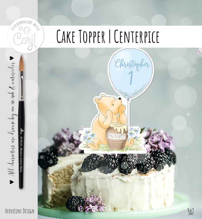 May include: Winnie the Pooh cake topper with a blue balloon that says "Christopher 1" and a honey pot. The topper is on a white cake with blackberries and purple flowers.
