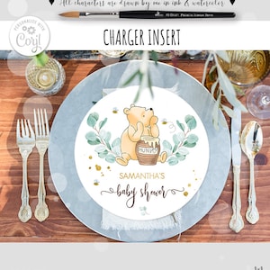May include: A Winnie the Pooh themed baby shower charger insert with a watercolor illustration of Winnie the Pooh holding a honey pot. The text "Samantha's baby shower" is written in cursive below the illustration.