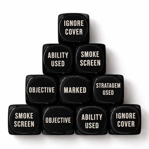 May include: A pyramid arrangement of ten black six-sided dice with white text. The faces display the phrases IGNORE COVER, ABILITY USED, SMOKE SCREEN, OBJECTIVE, MARKED, and STRATAGEM USED in a clear, sans-serif font on each individual die.