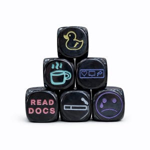 May include: A set of three ceramic nesting bowls in shades of blue, green, and white. The bowls feature a speckled glaze and a simple, modern design. The largest bowl measures approximately 8 inches in diameter.