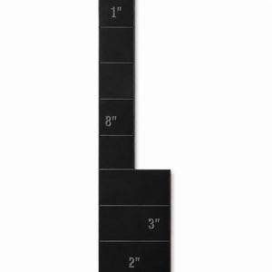 May include: A black, L-shaped measuring tool with measurements in inches. The vertical section is 9 inches long, with markings for 1" and 8". The horizontal section is 5 inches long, with markings for 3" and 2".