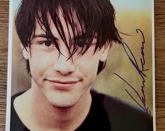 キアヌ・リーブス直筆サイン入り写真 - COA認証済み - プロテクター