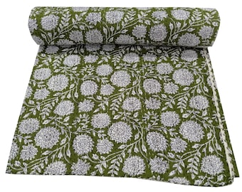 May include: A green and white kantha quilt with a floral pattern. The quilt is made of cotton and is hand-stitched.
