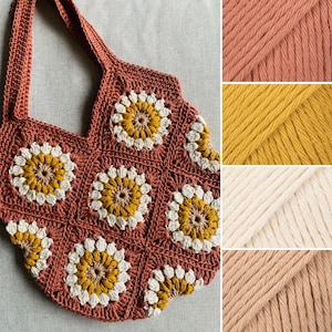 May include: A handmade crochet tote bag in a terracotta color, featuring a floral pattern with yellow and white accents. The bag has a sturdy handle and is displayed with close-ups of the yarn colors used: terracotta, yellow, cream, and light brown.