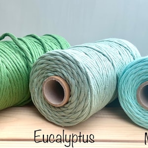 May include: Three spools of cotton rope in shades of green. The spools are labelled "Grass", "Eucalyptus", and "Mint".