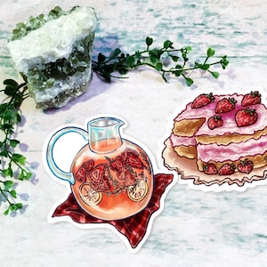 May include: Two hand-drawn illustrations of summer treats: a pitcher of strawberry lemonade with lemon slices and herbs, and a strawberry cake with pink frosting and a slice removed.